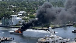 Fort Lauderdale, FL, firefighters battled a massive boat fire that injured two people and shut down the intercostal waterway in both directions Sunday.