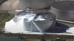Firefighters used foam to extinguish a blaze that broke out following the explosion of an oil storage tank near the Texas A&M University Galveston campus Tuesday. Firefighters used foam to extinguish a blaze that broke out following the explosion of an oil storage tank near the Texas A&M University Galveston campus Tuesday.