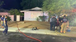 Las Vegas firefighters rescued a woman and a dog from a burning one-story house Thursday night. Las Vegas firefighters rescued a woman and a dog from a burning one-story house Thursday night.