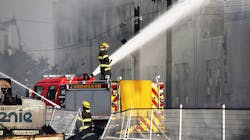 Minneapolis firefighters hose down a building Thursday after fires erupted throughout the city following protests in the wake of the death of George Floyd. Minneapolis firefighters hose down a building Thursday after fires erupted throughout the city following protests in the wake of the death of George Floyd.