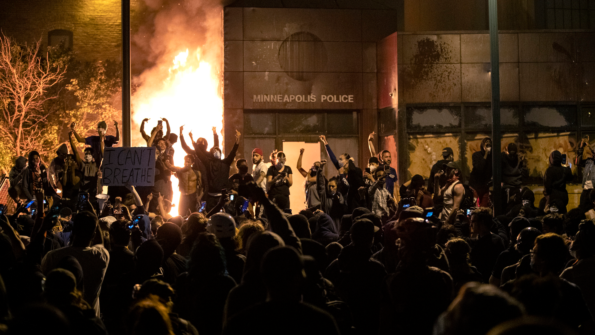 The Minneapolis Third Police Precinct is set on fire Thursday during a third night of protests following the death of George Floyd while in police custody.