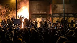 The Minneapolis Third Police Precinct is set on fire Thursday during a third night of protests following the death of George Floyd while in police custody.