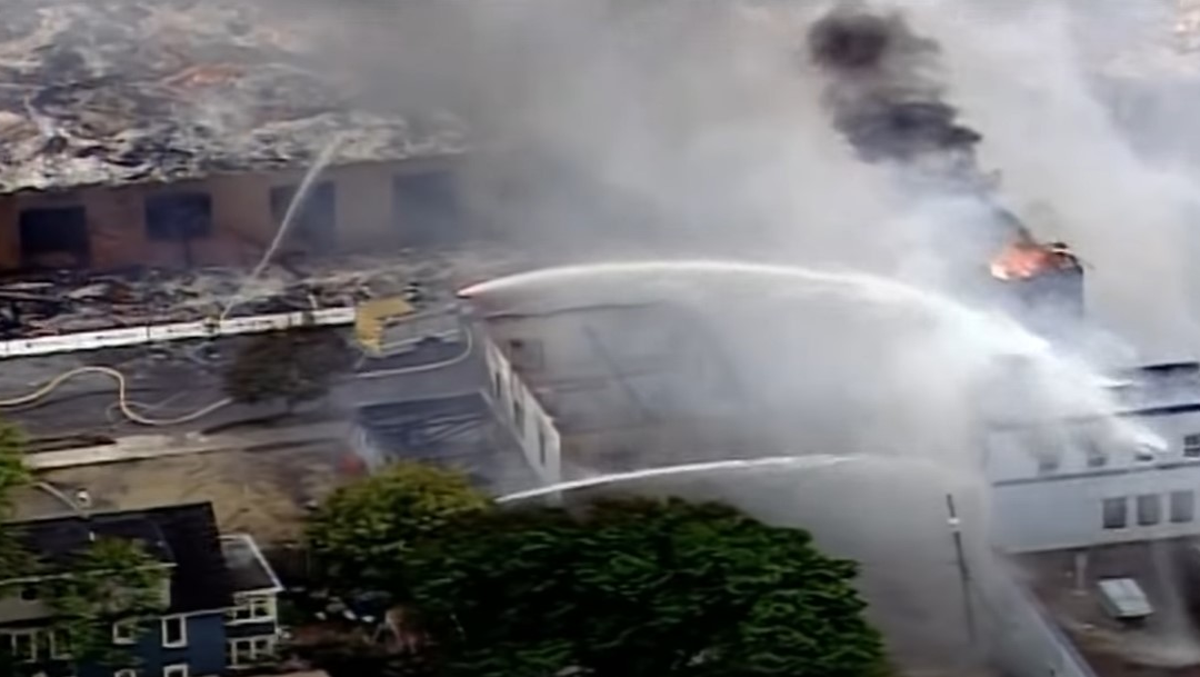 Minneapolis firefighters work to put out fires started Friday during protests over the death of George Floyd.