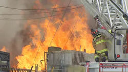 Oklahoma City, OK, firefighters battled a four-alarm blaze that destroyed four buildings near downtown Sunday.
