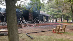 Two Anne Arundel County, MD, firefighters suffered minor burns trying to rescue a woman from a burning waterfront home in Pasadena on Thursday.