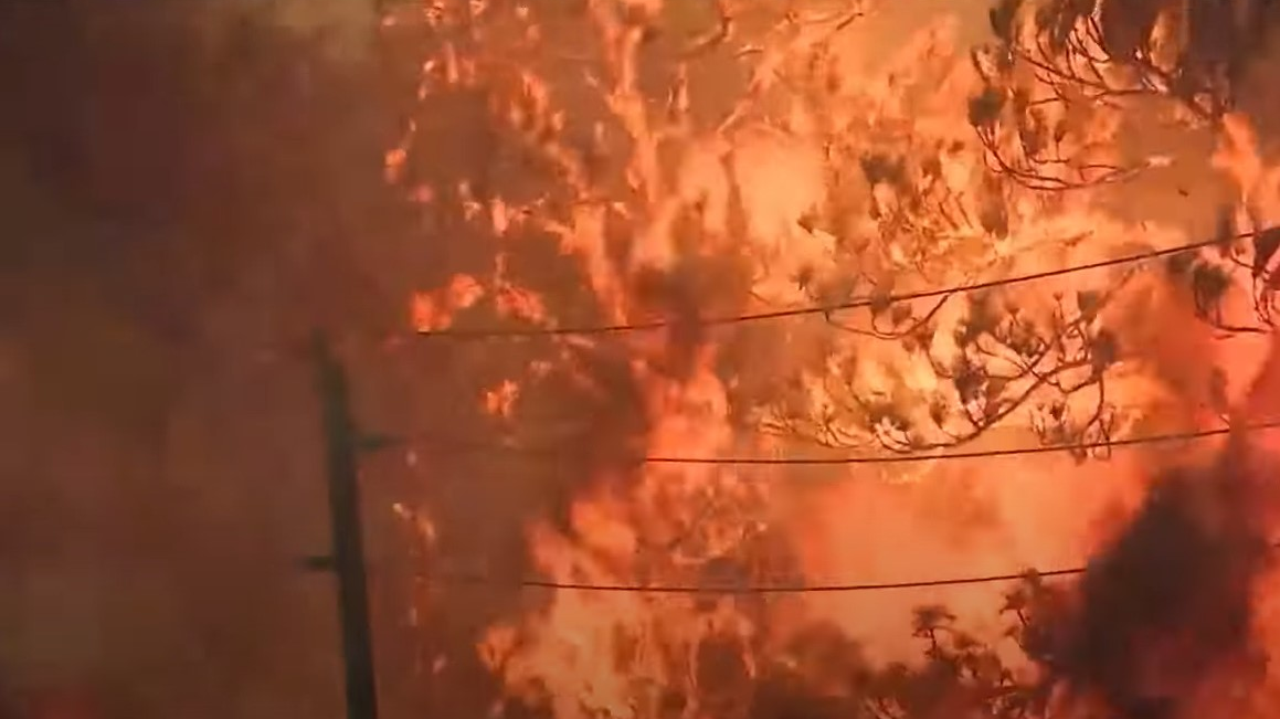 At least 500 people have been evacuated and 18 homes destroyed as a raging wildfire moves through Santa Rosa County in the Florida Panhandle.