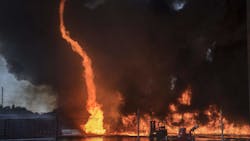 A fire tornado erupts during a plastic pallet fire at the former Mizkan America facility on D Street near Poplar Street in east Stockton, CA, on Tuesday. A fire tornado erupts during a plastic pallet fire at the former Mizkan America facility on D Street near Poplar Street in east Stockton, CA, on Tuesday.