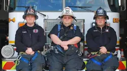 Assistant Fire Chief Robert E. Zerman sits between his firefighter sons Robert J. and Brandon in this undated photo.
