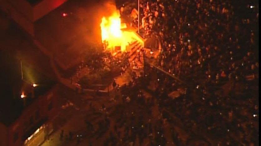 Fire begins to rage at the 3rd Police Precinct in Minneapolis on May 28, 2020, after protesters stormed the facility, forcing station personnel to evacuate.