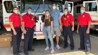 Foxborough firefighters with former New England Patriots star Rob Gronkowski and model Camille Kostek.