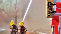 More than 100 Philadelphia firefighters battled a three-alarm blaze that broke out at a three-story building in the Center City area during protests Saturday.