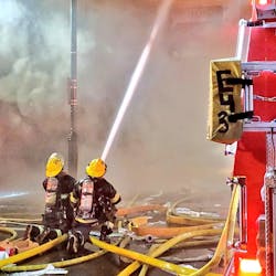 More than 100 Philadelphia firefighters battled a three-alarm blaze that broke out at a three-story building in the Center City area during protests Saturday.