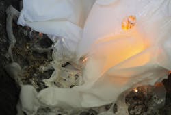 A burning shower curtain demonstrates the dangers of using the plastic material to separate customers, including smoke and hot dripping plastic. A burning shower curtain demonstrates the dangers of using the plastic material to separate customers, including smoke and hot dripping plastic.