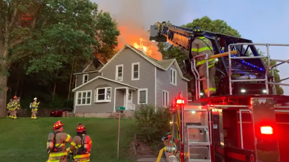 Firefighters rescued two people from a burning Chippewa Falls, WI, residential building early Sunday.