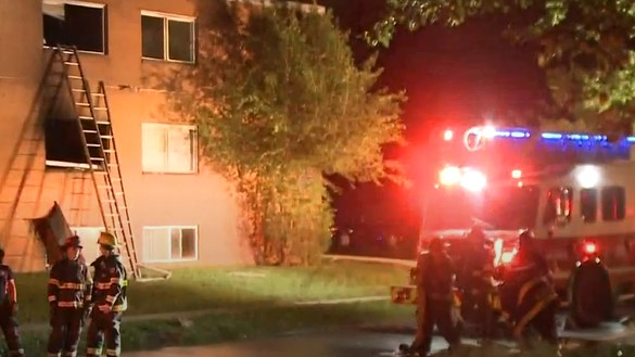 Cleveland firefighters rescued a mother and child from a burning third-story apartment on the city's east side early Thursday.