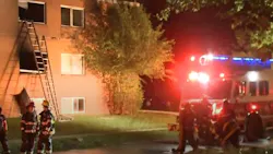 Cleveland firefighters rescued a mother and child from a burning third-story apartment on the city's east side early Thursday.