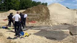 A retired Concord, MA, firefighter helped rescued a construction worker who fell into a trench at a country club Tuesday.