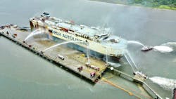 Jacksonville, FL, fire boats and firefighters sprayed the ship's hull to keep it cool and intact as the blaze on board slowly burnt out. Jacksonville, FL, fire boats and firefighters sprayed the ship's hull to keep it cool and intact as the blaze on board slowly burnt out.