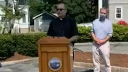 Firefighters from then New Bedford, MA, and Fall River fire departments honored their chaplain, the Rev. Michael Racine (center), with a surprise thank-you event Wednesday.