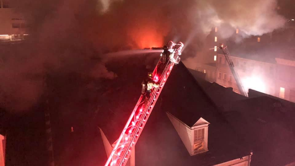 Two New Orleans firefighters were injured during a four-alarm hotel blaze late Thursday.