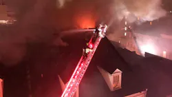 Two New Orleans firefighters were injured during a four-alarm hotel blaze late Thursday.