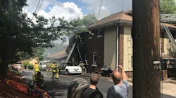 A Pittsburgh firefighter was injured battling a blaze that began in a vehicle and spread to a duplex Monday.