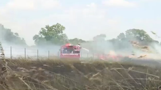 Firefighters from nearly a dozen departments battled three wheat field blazes that broke out in Reno County, KS, on Thursday.