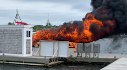 Firefighters from multiple departments stopped a boat fire spreading to the rest of Bridge Marina in Salisbury, MA, on Wednesday.