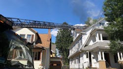 Two Springfield, MA, firefighters were burned while ventilating a burning three-story house Monday.