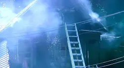Syracuse, NY, firefighters put out a house fire that extensively damaged the structure Wednesday.