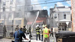 North Hudson Regional Fire and Rescue members respond to a three-alarm fire Wednesday on 54th Street in West New York, NJ.