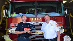 Jeffrey Braun (left), who is a firefighter/EMT-B for the Lyons, IL, Fire Department (LFD), with LFD Fire Chief Gordon Nord, Jr., who is holding one of two airport rescue firefighting vehicles (AARF) that Braun built from Lego blocks. Braun is holding the replica that he built of the Alsip, IL, Fire Department’s Engine 2063, which he made for that department’s chief. Jeffrey Braun (left), who is a firefighter/EMT-B for the Lyons, IL, Fire Department (LFD), with LFD Fire Chief Gordon Nord, Jr., who is holding one of two airport rescue firefighting vehicles (AARF) that Braun built from Lego blocks. Braun is holding the replica that he built of the Alsip, IL, Fire Department’s Engine 2063, which he made for that department’s chief.