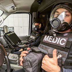 EMTs for Denver Health Paramedics prepare to respond to calls during protests and riots in the city in late May. EMTs for Denver Health Paramedics prepare to respond to calls during protests and riots in the city in late May.