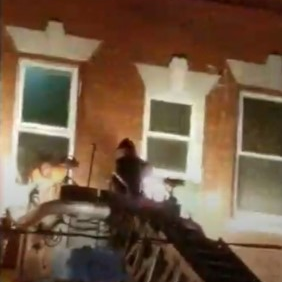 Firefighters rescued a man from a two-alarm blaze that broke out at a three-story apartment building in Hartford, CT, late Sunday.