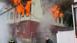New Bedford, MA, firefighters work to put out a two-alarm blaze that broke out at a vacant three-story building Friday.