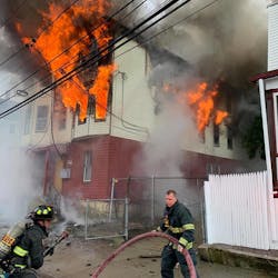 New Bedford, MA, firefighters work to put out a two-alarm blaze that broke out at a vacant three-story building Friday. New Bedford, MA, firefighters work to put out a two-alarm blaze that broke out at a vacant three-story building Friday.