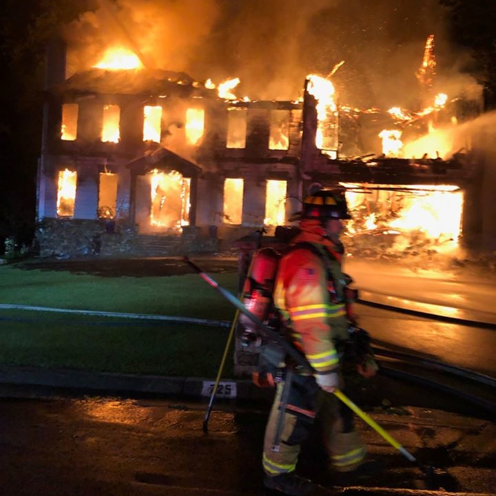 Roswell, GA, firefighters rescued an elderly man who was trapped in the basement of a burning two-story house early Tuesday.
