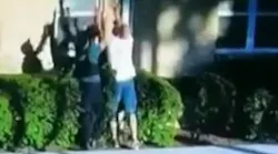 Secaucus, NY, police officers catch a boy, 4, who was dropped from the second-story window of a burning apartment Wednesday.
