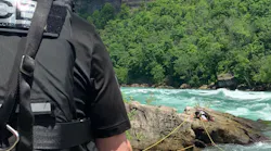 A man who became trapped on rocks in the Niagara Gorge is rescued by marine unit crews on June 6, 2020.