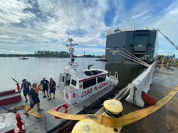 After the explosion that injured nine firefighters, crews were pulled out of the cargo ship and fire boats have been used to keep the fire in check. After the explosion that injured nine firefighters, crews were pulled out of the cargo ship and fire boats have been used to keep the fire in check.