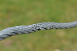 This fire department brush truck winch line shows obvious damage. The crushing and unraveling of the thin wires of several strands of this 6 x 19 IPS wire rope mean that the winch must go out-of-service until the line is replaced. This fire department brush truck winch line shows obvious damage. The crushing and unraveling of the thin wires of several strands of this 6 x 19 IPS wire rope mean that the winch must go out-of-service until the line is replaced.