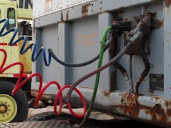 Commercial tractor trailer vehicles use an electrical cord for trailer lighting and two air hoses for trailer brake activation. The blue hose is the service brake line, and the red hose is the emergency brake line. Securing the connections aids in securing the vehicle from moving.