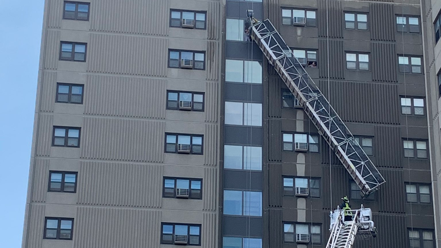 Boston firefighters rescued two window washers Thursday after a scaffold malfunction left them dangling 12 stories above the ground.