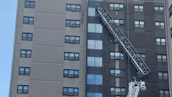Boston firefighters rescued two window washers Thursday after a scaffold malfunction left them dangling 12 stories above the ground.