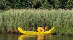Centerville-Osterville-Marstons Mills firefighters deployed an inflatable &apos;banana boat&apos; to rescue a woman stuck in mud and weeds at the end of the Herring River in Centerville on Wednesday.