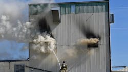 Two Galesburg, IL, firefighters suffered minor injuries battling a blaze at a food production facility Friday.