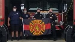 Hanover Township, PA, firefighters show off a recovered memorial flag that was stolen last week from the department. Hanover Township, PA, firefighters show off a recovered memorial flag that was stolen last week from the department.