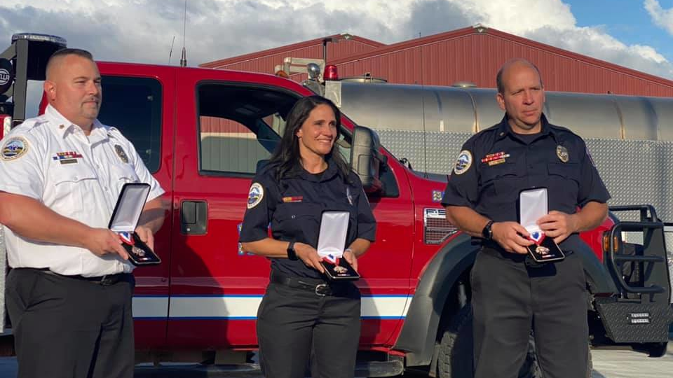 Harrisburg, OR, Fire Chief Bart Griffith (left), firefighter Aleshia DeLanoy and Capt. Matt McCarl received Medals of Honor for the rescue of a 61-year-old man during a 2019 house fire.
