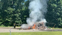 Hazle Township, PA, firefighters quickly extinguished a pile of burning trash that caught fire on a garbage truck and was dumped by the driver Tuesday. Hazle Township, PA, firefighters quickly extinguished a pile of burning trash that caught fire on a garbage truck and was dumped by the driver Tuesday.