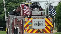 A Hingham, MA, fire apparatus displays a 'thin blue line' flag supporting police officers.